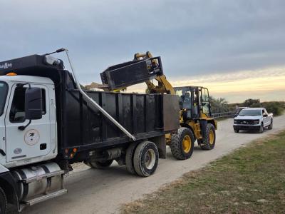 Digger loading a dump truck